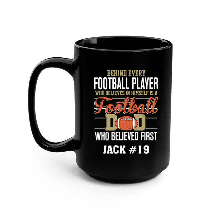 Personalized Behind Every Football Player Who Believes In Himself Is A Football Dad Who Believe First Mug, Custom Mug For Football Dad, Football Mom