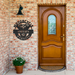 Custom_Motorcycle_Parking_Monogram_Sign__Black_Brick_Entrance_Mockup.png